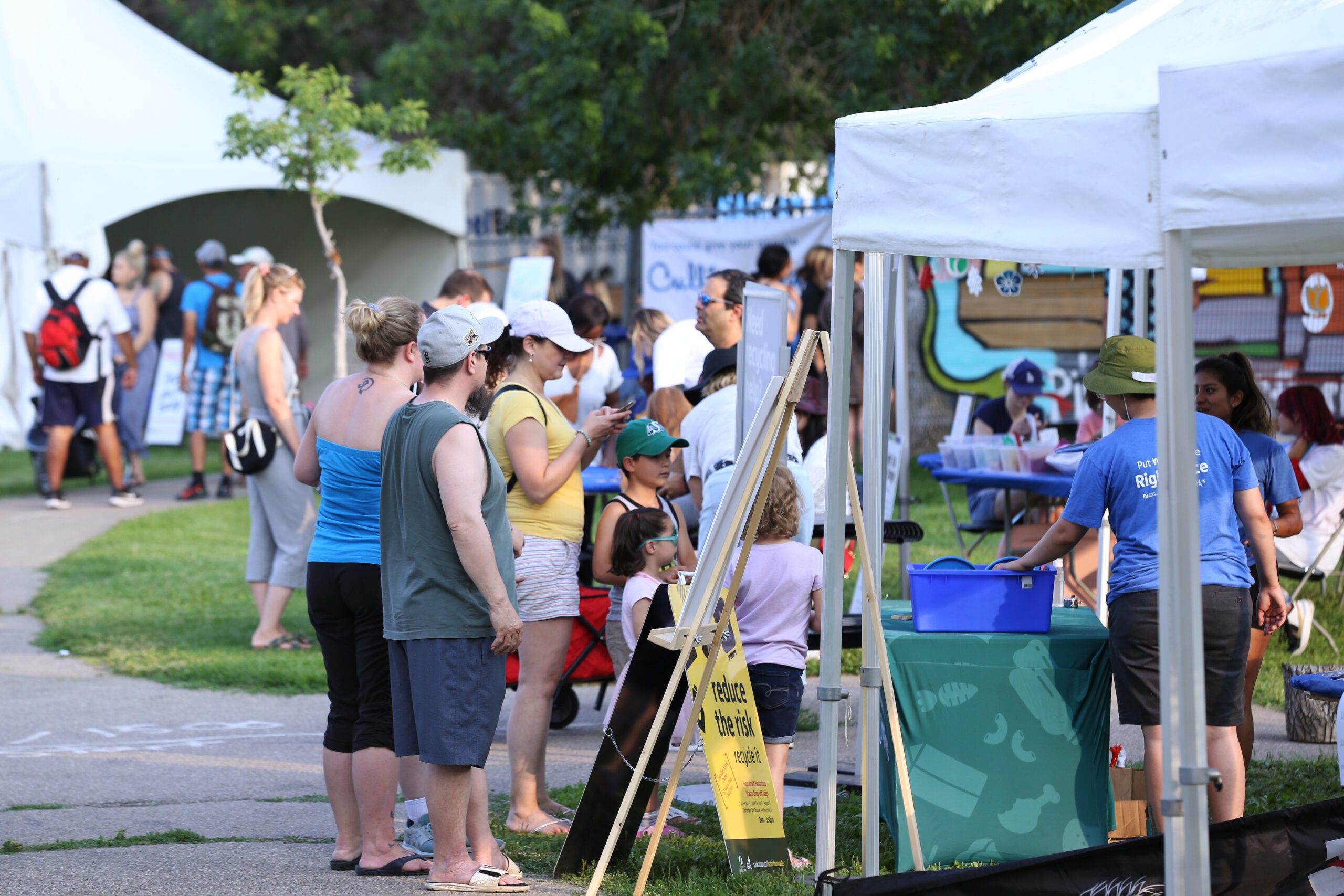 Fringe Festival, organization vendor with people, photo credit Nicole Stevenson